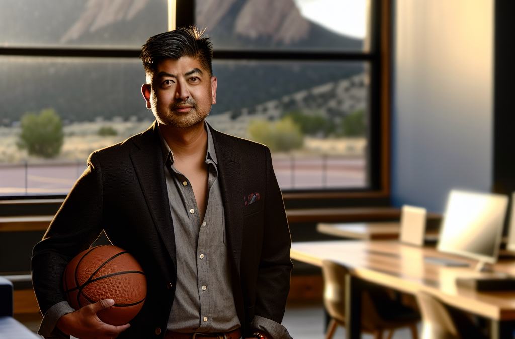 Businessman in a modern office holding a basketball, symbolizing motivation and sports-inspired leadership in western Colorado
